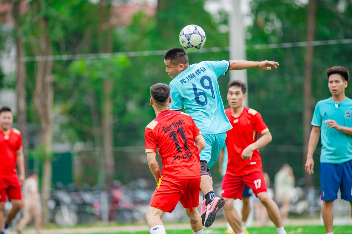 soccer players heading ball